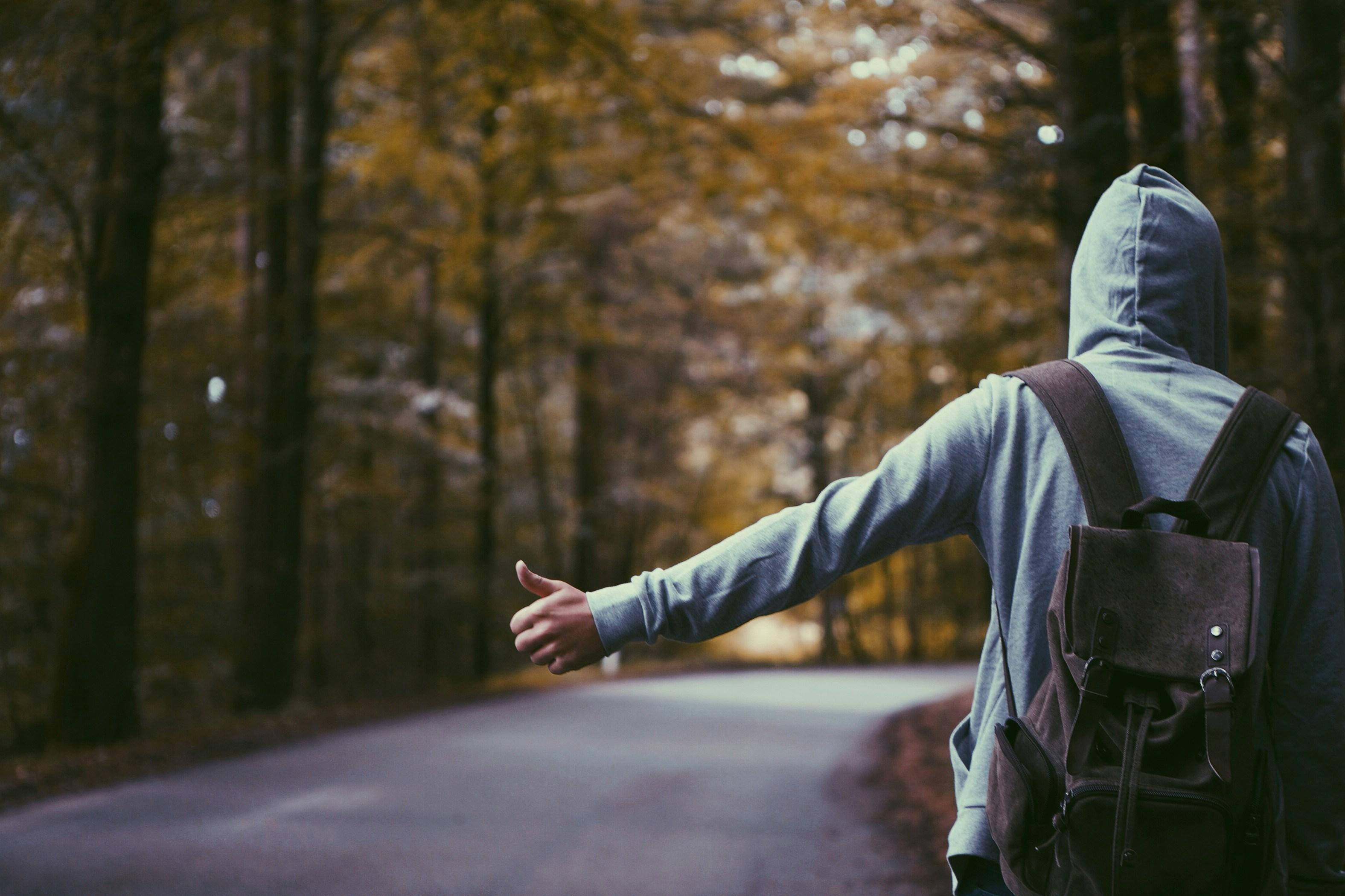 boy hitch hiking