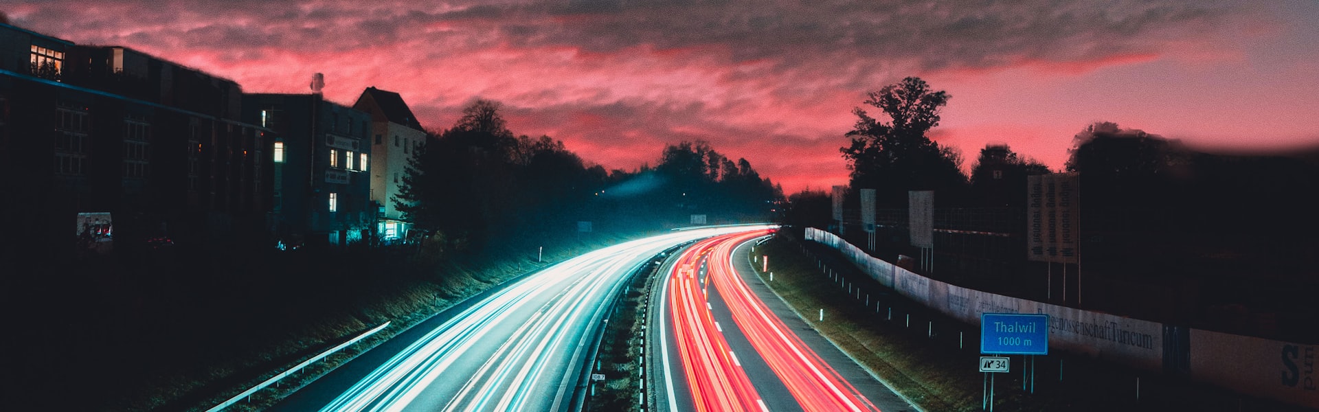 Road stretching into the distance with lights